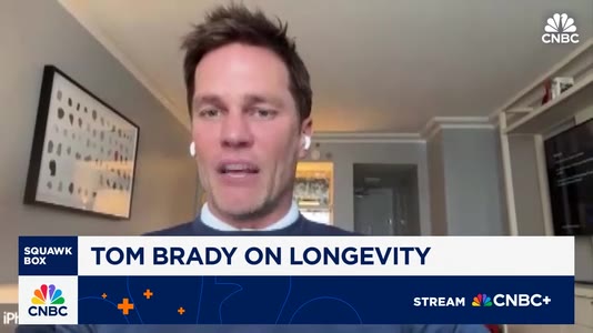 Tom Brady trying ARC robotic massage, featured on CNBC